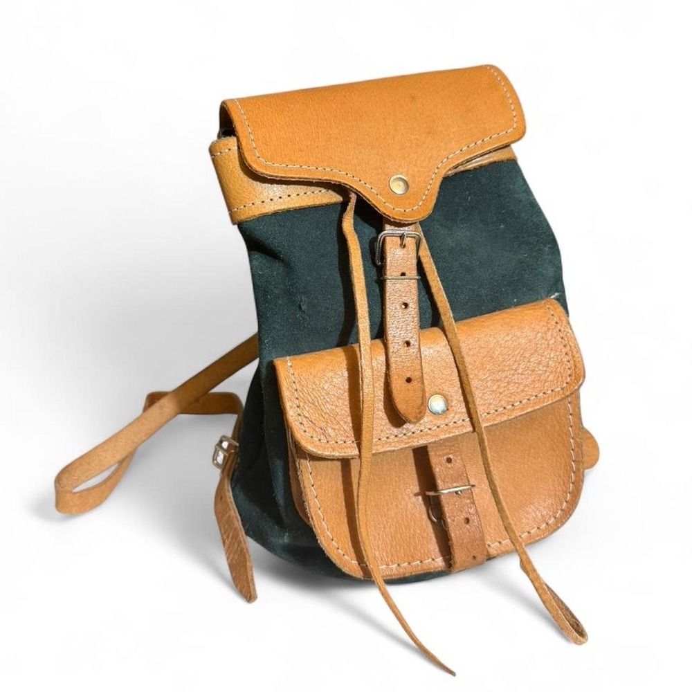 Forest Green Suede and Tan Leather backpack with adjustable straps.